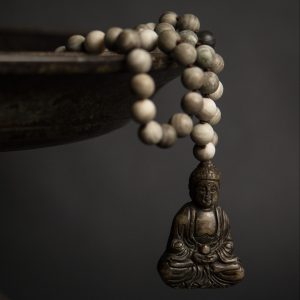 Jade vintage buddha on coffee wood jasper